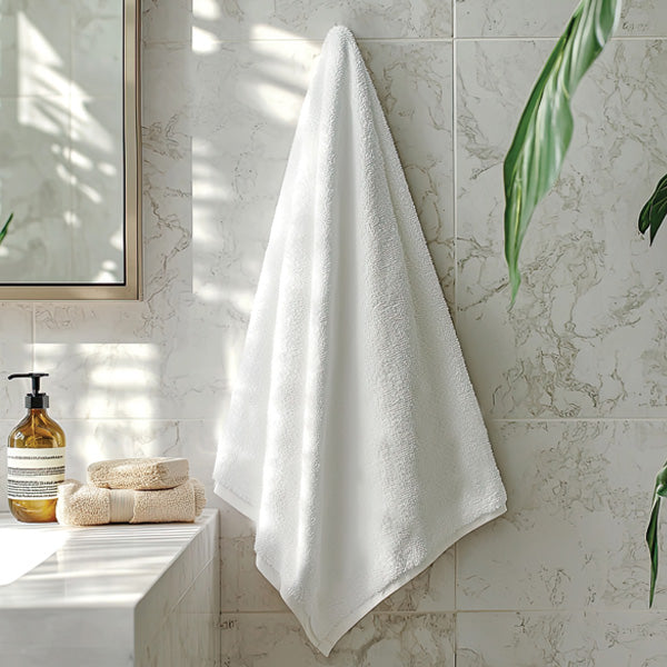 White fluffy towel hanging inside a modern bathroom