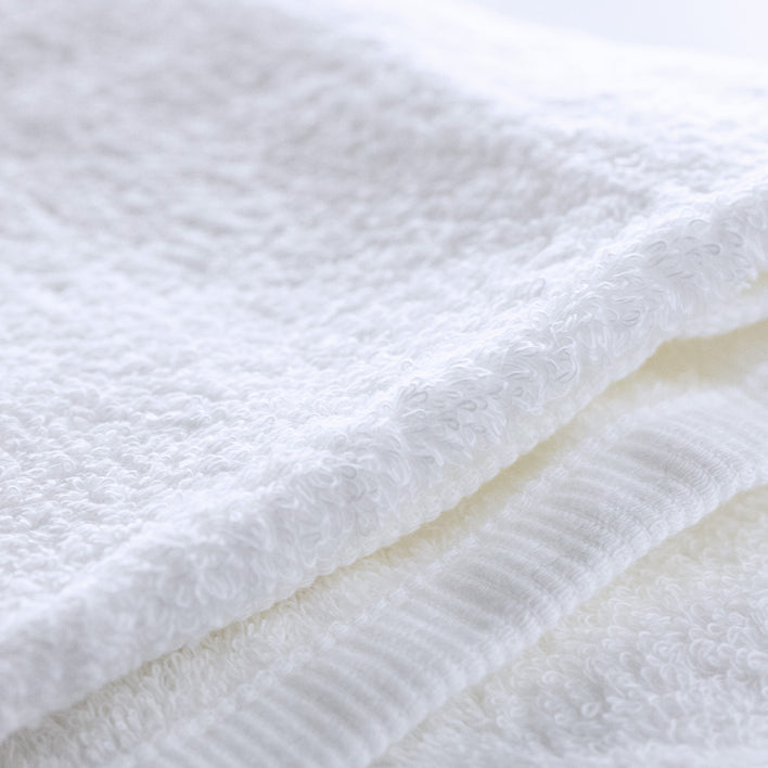 Close-up of soft, fluffy white towel fabric