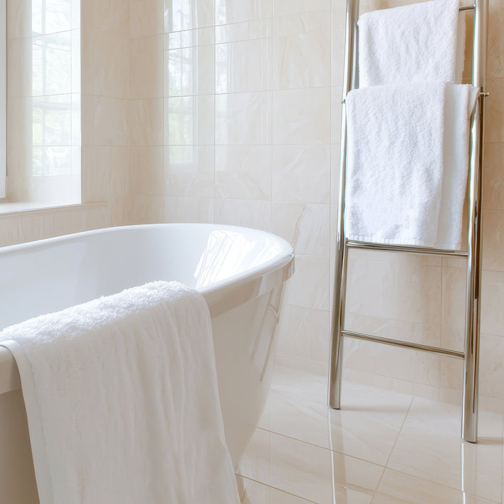 Plush white towels ready for a spa-like bath experience