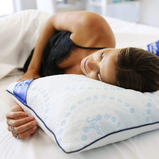 Woman sleeping on her side while her head is supported by a Super Sleeper Pro® pillow.