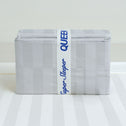 A folded light gray sheet set with subtle stripes is wrapped in a Super Sleeper Pro® Bed Sheet Organiser Band labeled “Super Sleeper Pro QUEEN”—a smart storage solution from Super Sleeper Pro (2 pack).