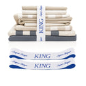 A stack of folded king-size TEST broken variant os bed sheets by Super Sleeper Pro in beige and white, secured with a “KING” ribbon. Includes two matching organiser bands for a neat linen cupboard.