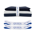 A folded set of navy and white TEST broken variant os bed sheets by Super Sleeper Pro, labeled QUEEN, comes with two white and blue organiser bands—perfect for keeping your linen cupboard tidy.