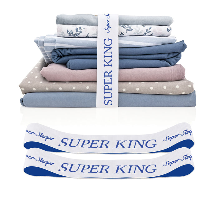 A stack of TEST broken variant os bed sheets by Super Sleeper Pro in blue and gray, wrapped with a “Super King” ribbon and two organiser bands below—an efficient storage solution.