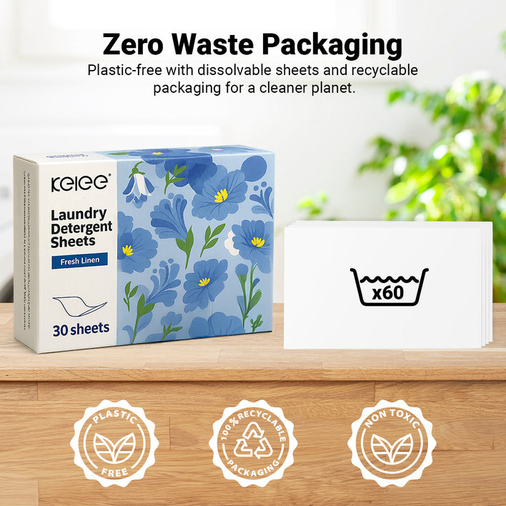 Box of Kleva Range Stain Lifting Laundry Detergent Sheets with a floral design and "30 sheets" label on a wooden surface. A card reads "x60." Icons emphasize plastic-free packaging and this eco-friendly laundry solution.