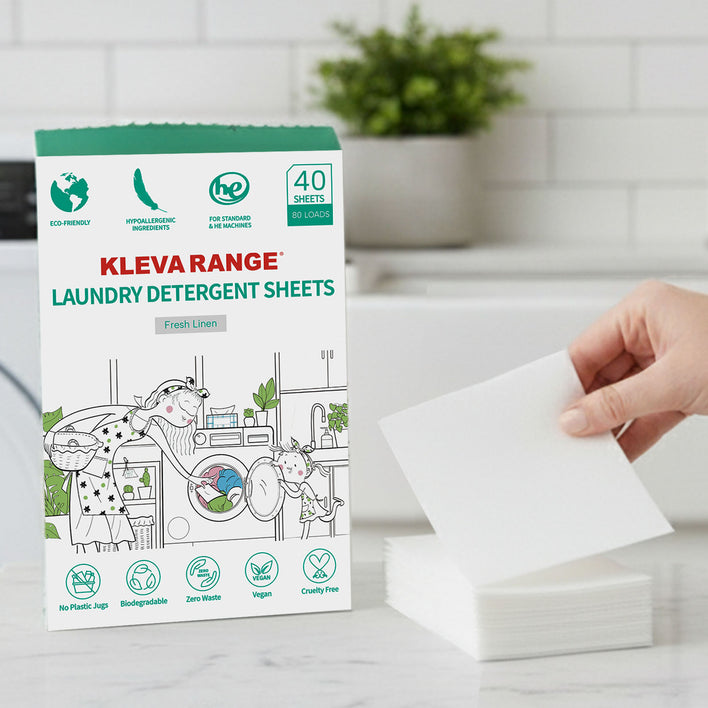 A hand holds a white sheet next to a stack, reflecting the simplicity and ease of Kleva Range Stain Lifting Laundry Detergent Sheets Fresh Linen—eco-friendly, plastic-free sheets for laundry, with 40 sheets for 80 washes.