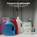 A shelf under a sink holds colorful detergent bottles and a box of Kleva Range Stain Lifting Laundry Detergent Sheets Fresh Linen (40 sheets/80 washes), with folded towels in the background. Text reads: Compact & Lightweight.