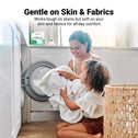 A woman and child kneel by a front-loading washer with white towels. Kleva Range Stain Lifting Laundry Detergent Sheets, Fresh Linen, offer eco-friendly, plastic-free laundry care—tough on stains, gentle on skin and fabrics.