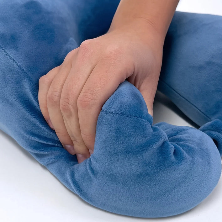 Close-up of soft memory foam travel pillow showing pressure-relief support