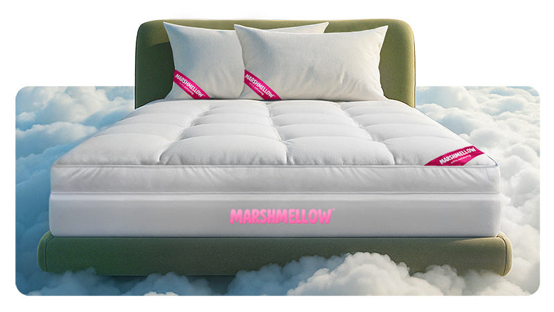A white mattress labeled MARS&MELLOW is placed on a green bed frame, with three white pillows, appearing to float above a bed of fluffy clouds.