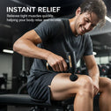 Athlete using compact massage gun on leg for post-workout muscle relief and recovery