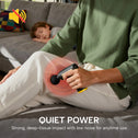 Quiet portable massage gun providing deep tissue muscle relief while relaxing at home