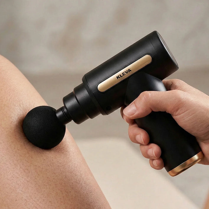 Handheld mini massage gun providing targeted leg muscle therapy