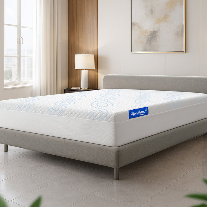 Mattress on a bed in a room with a lamp and window