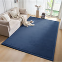 Royal Blue tatami floor mat used as a soft floor mat tatami style rug in a modern living room beside a beige sofa.