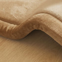 Close-up of a plush tatami floor mat texture, showing its soft padded surface.