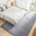 Large gray tatami floor mat placed under a bed, used as a sleeping tatami floor mat for added comfort.