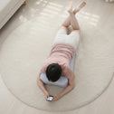 Ergonomic support pillow used on floor for back and neck support