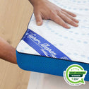 Sleep Sleeper mattress topper with a hand touching it on a wooden floor, featuring an 'Awards Winner' badge.