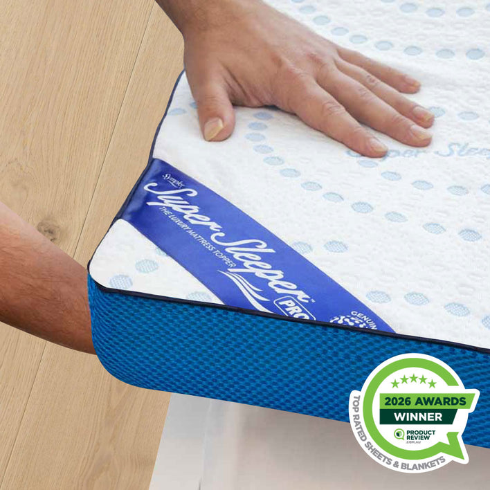 Sleep Sleeper mattress topper with a hand touching it on a wooden floor, featuring an 'Awards Winner' badge.