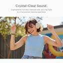 A young woman in a light blue sleeveless top dances outdoors, eyes closed and smiling, wearing Kleva® AudioUltra Noise Cancelling Wireless Bluetooth Headphones by Kleva Range. Above her, text reads: Crystal–Clear Sound with premium audio and long battery life.