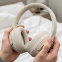 Kleva® AudioUltra Noise Cancelling Wireless Bluetooth Headphones by Kleva Range are over-ear, off-white headphones with cushioned ear pads and right earcup controls, featuring the logo in the top left corner.