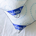 Pillows overlapping each other on a white sheet