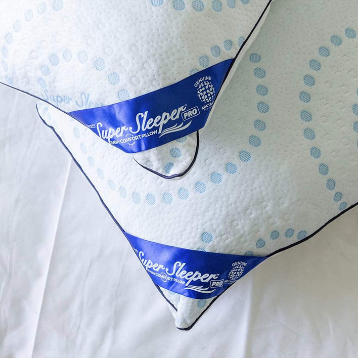 Pillows overlapping each other on a white sheet