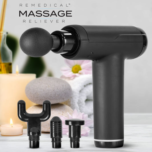 A massage gun and three attachments with a nice, bright background. 