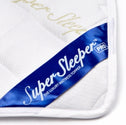 Close-up of the Replacement Cover For Super Sleeper Pro® Wave Topper by Super Sleeper Pro, featuring a white quilted bamboo viscose fabric and a blue label in the corner.