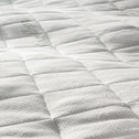 Close-up of the white, textured grid-pattern cover for the Super Sleeper Pro® Wave Topper Replacement Cover, featuring subtle stitching and a soft bamboo viscose surface from Super Sleeper Pro.